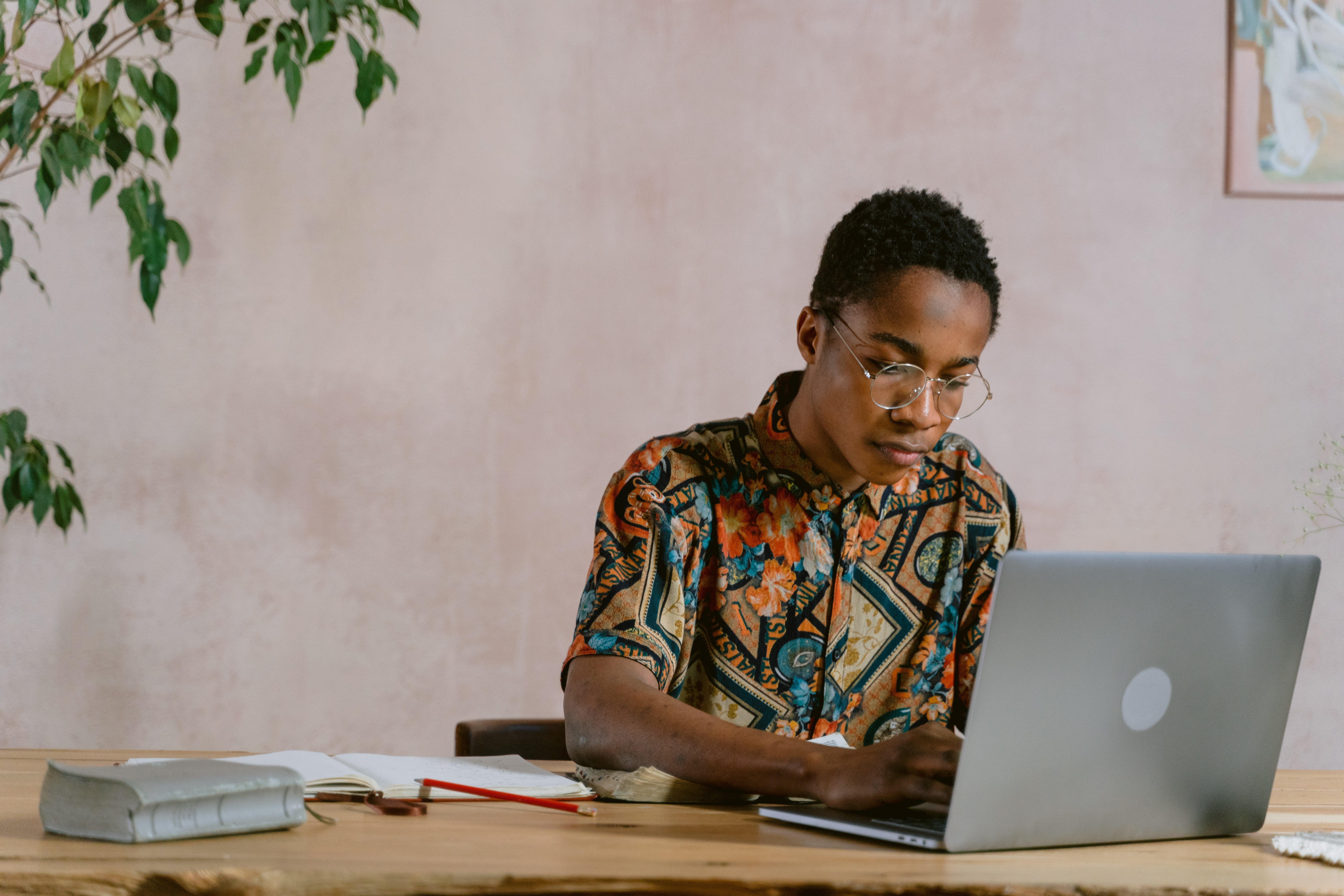 picture of a person sitting with a laptop